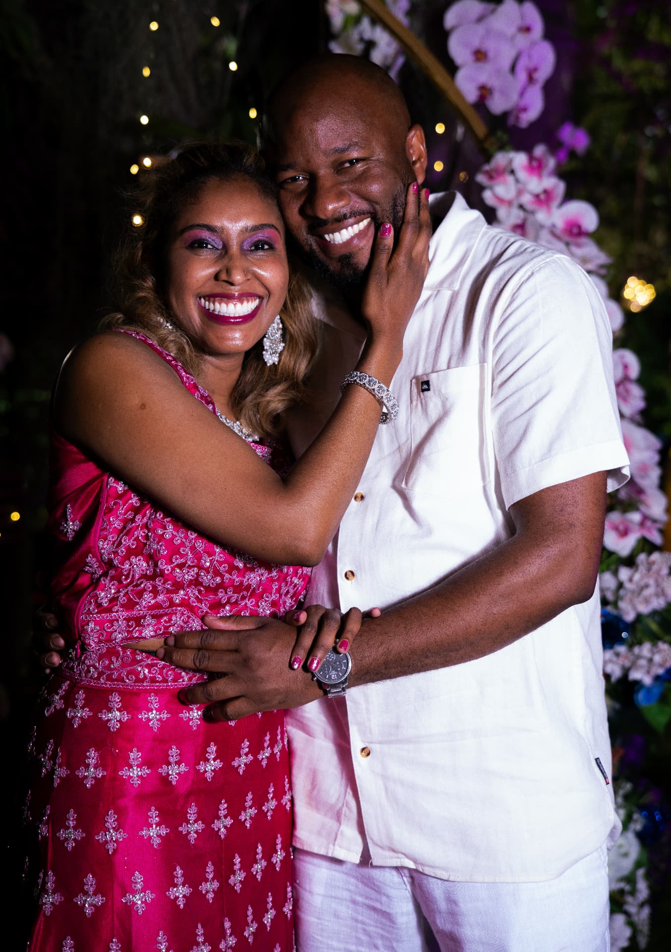 Couple photographed at an evening celebration